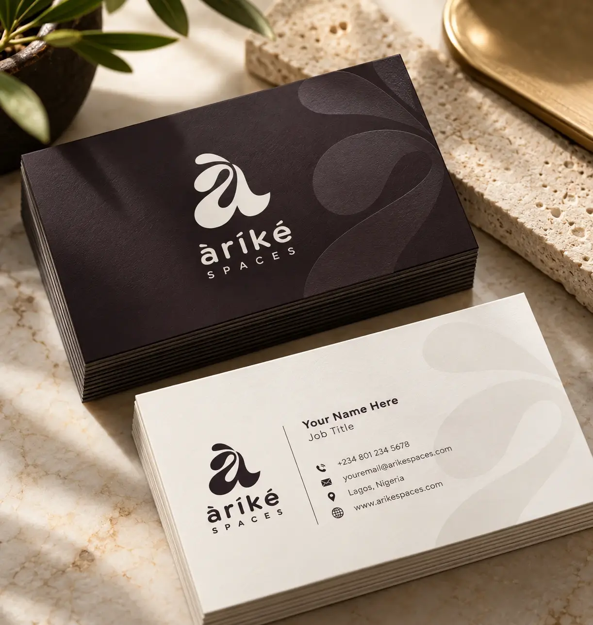 Arike Spaces business cards in grape and cream